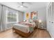 Bright bedroom features modern decor, wood floors, and a ceiling fan at 4677 Del Sol Blvd, Sarasota, FL 34243