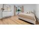 A bright bedroom with luxury vinyl floors and stylish decorations at 4677 Del Sol Blvd, Sarasota, FL 34243