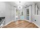 Bright breakfast nook with modern light fixture and view of the pool at 4677 Del Sol Blvd, Sarasota, FL 34243