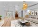 Inviting living room featuring hardwood floors, neutral decor, and stylish furniture at 4677 Del Sol Blvd, Sarasota, FL 34243