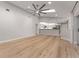 Open-concept living area showcasing wood floors and a view into the well-equipped kitchen at 4677 Del Sol Blvd, Sarasota, FL 34243