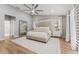 Comfortable main bedroom features neutral decor, a ceiling fan, and ample natural light at 4677 Del Sol Blvd, Sarasota, FL 34243