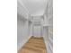 A neat walk-in closet with custom shelving and modern hardware at 4677 Del Sol Blvd, Sarasota, FL 34243
