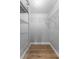 A walk-in closet with wire shelving and wood-look floors at 4677 Del Sol Blvd, Sarasota, FL 34243