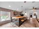 Charming bar area featuring a brick wall, wood countertop, and adjacent seating, perfect for hosting and entertaining at 4815 Plantation Dr, Tampa, FL 33615