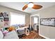 Bedroom featuring a daybed, closet, a ceiling fan, a work desk, and a window allowing natural light at 4815 Plantation Dr, Tampa, FL 33615