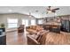 Spacious living room with hardwood floors, a vaulted ceiling, and a rustic bar at 4815 Plantation Dr, Tampa, FL 33615