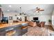 Spacious living area featuring a bar, comfortable furniture, hardwood flooring, and large windows, offering great natural light at 4815 Plantation Dr, Tampa, FL 33615