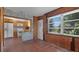 Kitchen flowing into a sunroom, offering a blend of indoor and outdoor living space at 5000 18Th S Ave, Gulfport, FL 33707