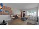Inviting living room with a brick accent wall and large window, ideal for relaxation at 5000 18Th S Ave, Gulfport, FL 33707
