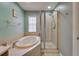 This bathroom showcases a soaking tub and glass-enclosed shower at 5033 Blue Runner Ct, New Port Richey, FL 34652