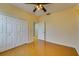 Bedroom with bamboo floors and a double closet, providing ample storage space at 5033 Blue Runner Ct, New Port Richey, FL 34652