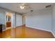 Spacious bedroom with wood floors, ensuite bathroom, and a large closet providing ample storage at 5033 Blue Runner Ct, New Port Richey, FL 34652