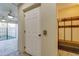 Entryway with ceramic stone flooring, coat rack and a door leading to a screened porch with ceiling fans at 5033 Blue Runner Ct, New Port Richey, FL 34652