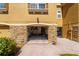 Attached garage with brick accents and a view of interior storage and bicycles at 5033 Blue Runner Ct, New Port Richey, FL 34652