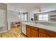 Kitchen and Dining area with wood cabinets and eat-in bar top at 5033 Blue Runner Ct, New Port Richey, FL 34652