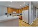 Bright kitchen with wood cabinets, white countertops, and appliances at 5033 Blue Runner Ct, New Port Richey, FL 34652