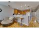 Open-concept living space features a kitchen bar and inviting seating at 5033 Blue Runner Ct, New Port Richey, FL 34652