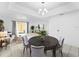 Inviting dining area with backyard views and open floor plan to living room at 7535 Abonado Rd, Tampa, FL 33615