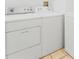 Laundry area includes full-size washer and dryer in white at 7535 Abonado Rd, Tampa, FL 33615