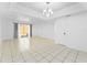 Bright and spacious living room area with sliding glass door access to backyard at 7535 Abonado Rd, Tampa, FL 33615