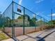 A well-maintained community tennis court with visible fencing and court lines on a clear, sunny day at 7535 Abonado Rd, Tampa, FL 33615