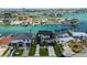 Modern home with sleek design, complemented by a well-manicured lawn and beautiful waterfront access at 7974 1St S Ave, St Petersburg, FL 33707