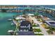 Waterfront property featuring a modern design with lush lawn and private water access at 7974 1St S Ave, St Petersburg, FL 33707