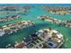 Breathtaking aerial view showcases a network of waterways and the luxurious waterfront houses in the community at 7974 1St S Ave, St Petersburg, FL 33707