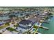 Waterfront home featuring a private dock, lush landscaping, and an inviting pool overlooking scenic water views at 7974 1St S Ave, St Petersburg, FL 33707