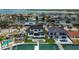 Scenic waterfront property featuring a private dock, pool, and lush landscaping, creating an ideal setting for luxury waterfront living at 7974 1St S Ave, St Petersburg, FL 33707