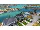 Contemporary waterfront residence features a pristine lawn and convenient access to the open water at 7974 1St S Ave, St Petersburg, FL 33707
