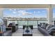 Relaxing balcony with water views, comfortable seating, and an outdoor grill, perfect for entertaining at 7974 1St S Ave, St Petersburg, FL 33707