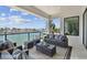 Inviting balcony with waterfront views and modern outdoor furniture, great for enjoying the scenery at 7974 1St S Ave, St Petersburg, FL 33707