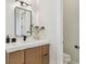 Stylish vanity with modern fixtures and adjacent water closet at 7974 1St S Ave, St Petersburg, FL 33707