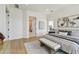 Spacious bedroom with neutral tones, stylish decor, and wood flooring at 7974 1St S Ave, St Petersburg, FL 33707