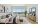 Bedroom featuring a large window with water views, a dresser, and neutral decor at 7974 1St S Ave, St Petersburg, FL 33707