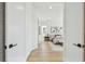 Hallway view into a beautifully decorated bedroom with serene colors and natural light at 7974 1St S Ave, St Petersburg, FL 33707