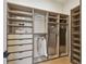 Spacious walk-in closet featuring built-in shelves and drawers at 7974 1St S Ave, St Petersburg, FL 33707