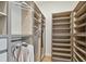 Custom walk-in closet with ample shelving, drawers, and hanging space for clothing and accessories at 7974 1St S Ave, St Petersburg, FL 33707