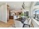 Dining area with modern lighting, and an open concept view of the kitchen and living areas at 7974 1St S Ave, St Petersburg, FL 33707