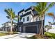 Modern two-story home boasts contemporary design, landscaping, and a multi-car garage at 7974 1St S Ave, St Petersburg, FL 33707