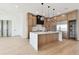 Modern kitchen features custom cabinets, quartz counters, stainless appliances, and pendant lighting at 7974 1St S Ave, St Petersburg, FL 33707