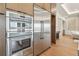 Kitchen with stainless steel appliances, including a double oven, a full size refrigerator, and custom cabinetry at 7974 1St S Ave, St Petersburg, FL 33707