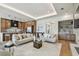 Open concept living room and kitchen with stainless steel appliances, and pendant lighting at 7974 1St S Ave, St Petersburg, FL 33707