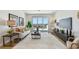 Bright living room featuring modern furniture, hardwood floors, a view of the outside, and stylish decor throughout at 7974 1St S Ave, St Petersburg, FL 33707