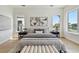 Bright main bedroom with waterfront views, stylish furnishings, and hardwood floors creates a cozy retreat at 7974 1St S Ave, St Petersburg, FL 33707