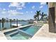 Gorgeous backyard features a pristine pool, with spa and picturesque waterfront views at 7974 1St S Ave, St Petersburg, FL 33707