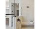 Luxurious bathroom shower with clear glass, dark hardware, and bright stone tiling at 7974 1St S Ave, St Petersburg, FL 33707