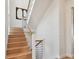 Modern staircase with wood steps and cable railings at 7974 1St S Ave, St Petersburg, FL 33707